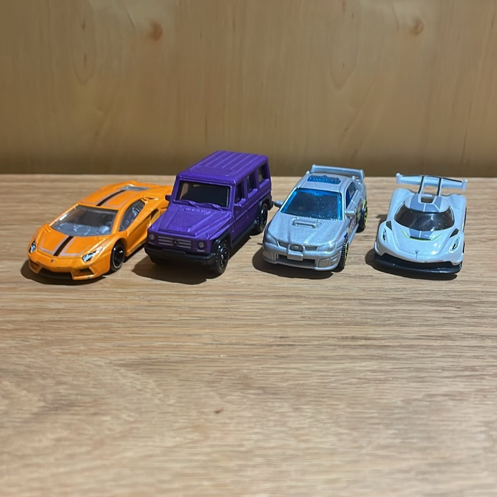 4 Car HotWheels and Matchbox Lot: Mercedes, Subaru, Koenigsegg, and Lamborghini.